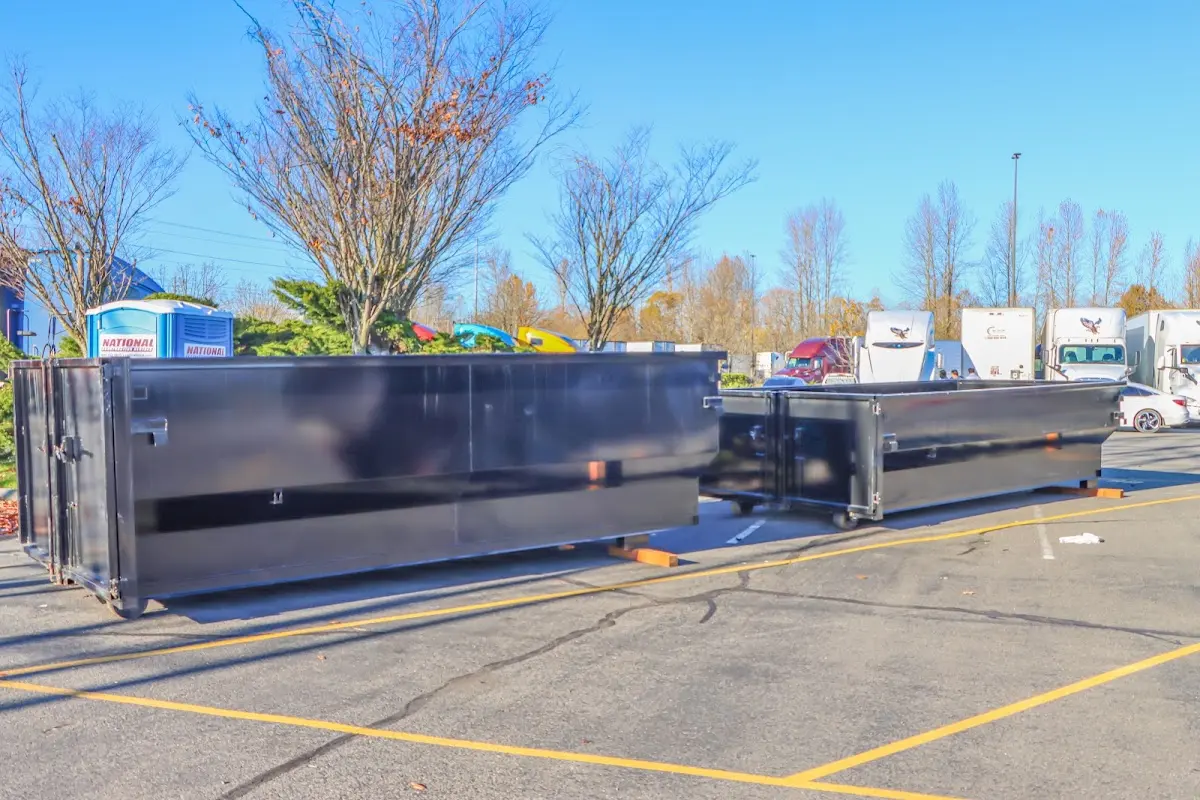 Professional dumpster rental service with roll-off container on residential driveway in Stokesdale
